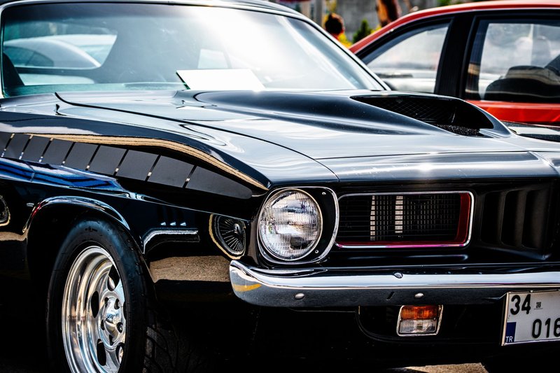 Detailed front view of a classic black American muscle car with a shiny chrome finish in Ankara, Türkiye.