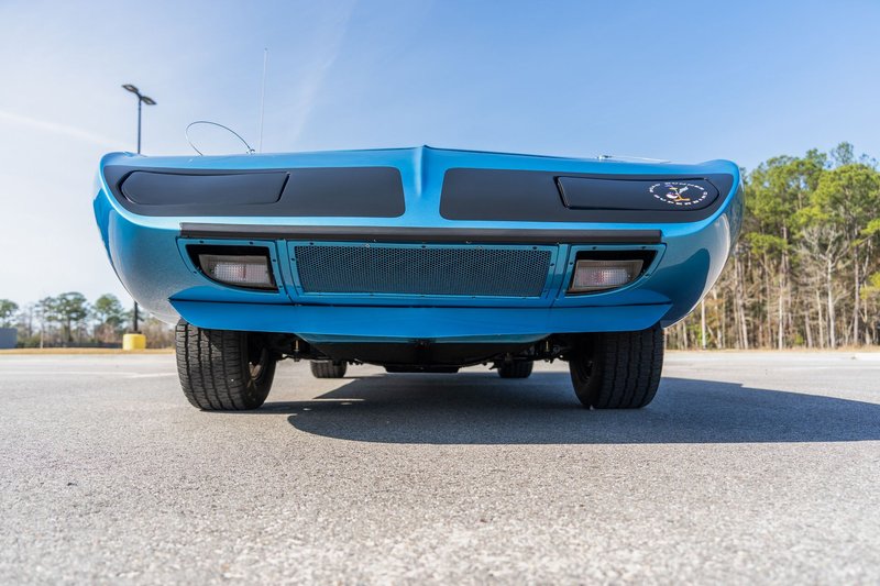 Iconic Plymouth Superbird car's front view captured outdoors in Madisonville, Louisiana.