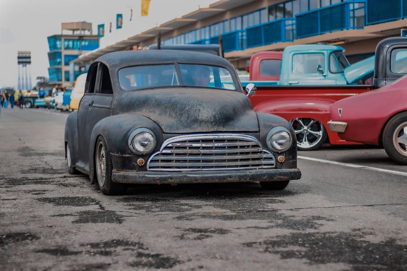 Rustic vintage cars displayed at Curitiba auto show, capturing classic charm.