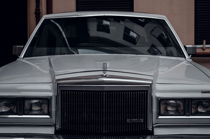 Front view of a classic Lincoln Continental Mark V in silver, showcasing vintage style and elegance.