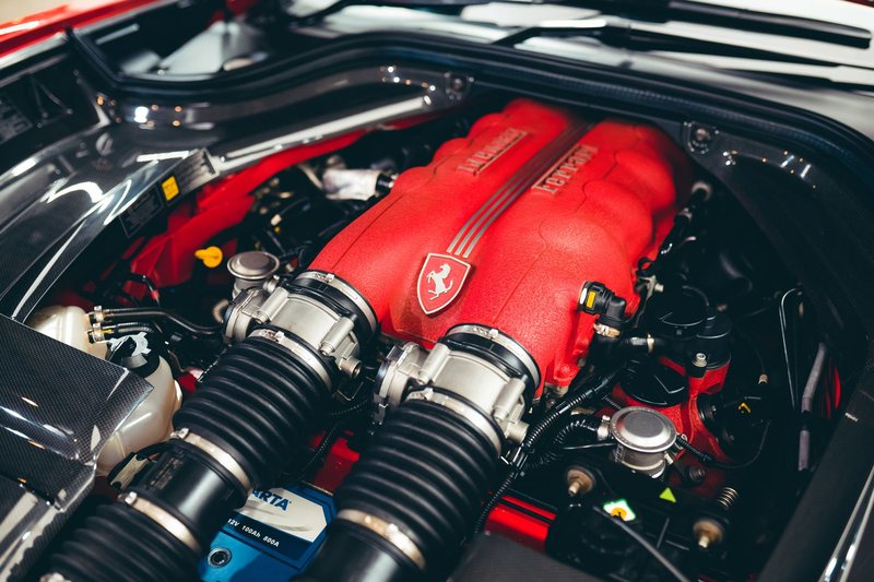 High angle of motor of modern sports car with various details under hood