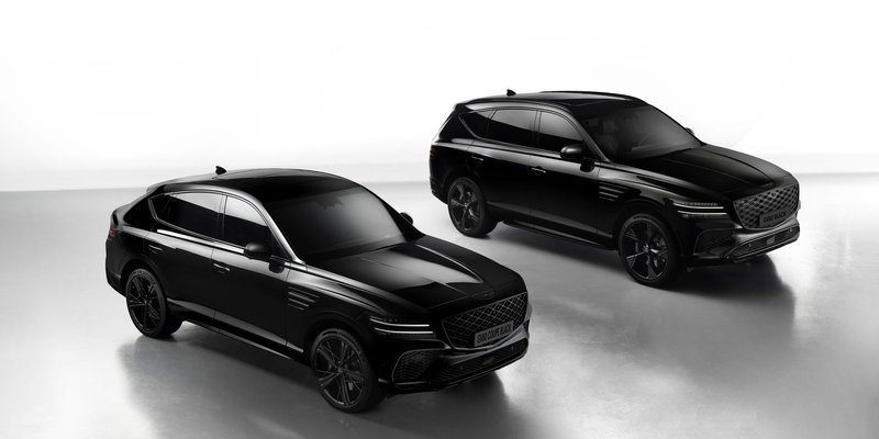 Sleek black Genesis GV80 SUVs showcased in a professional studio setting, emphasizing luxury and design.