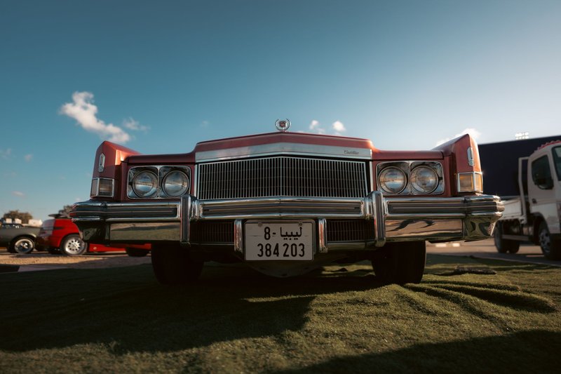 A classic 1970s red Cadillac with chrome details in Benghazi, Libya.