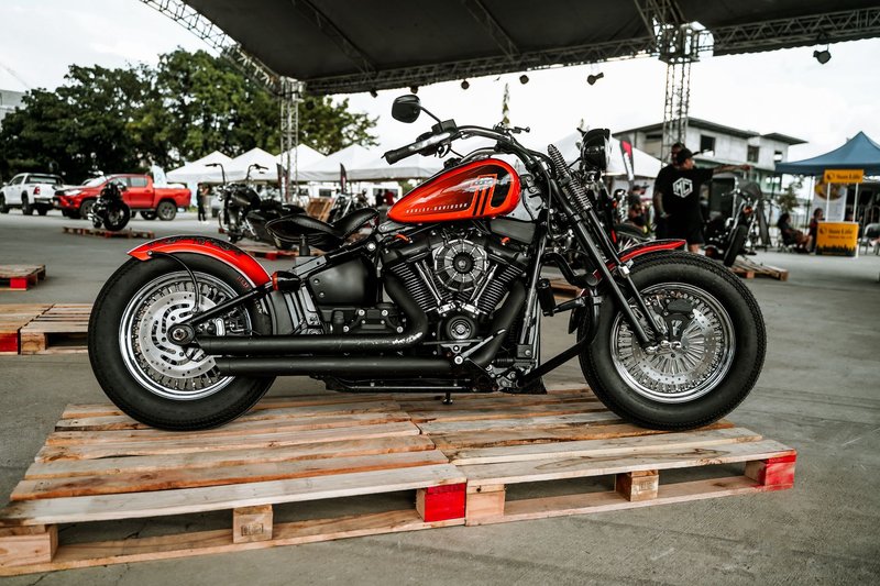 A classic motorcycle showcased at an outdoor event in Quezon City, Philippines.
