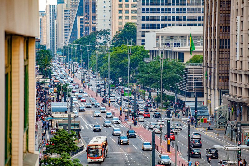 Aerial view of bustling Avenida Paulista in São Paulo, showcasing urban life and busy traffic.