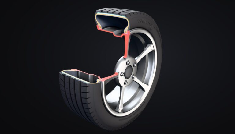 3D cutaway of a 225/45R17 car tire on an alloy wheel showing the inner liner, body ply, bead, steel belts, cap ply and tread