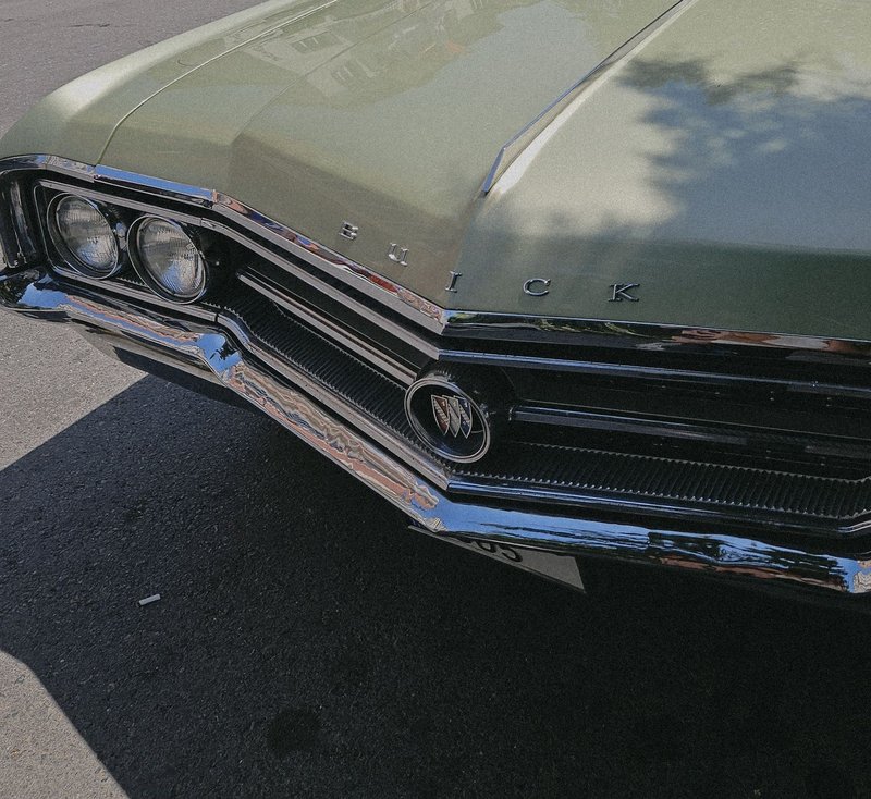 Close-up of a vintage Buick car showcasing its chrome details and classic design.