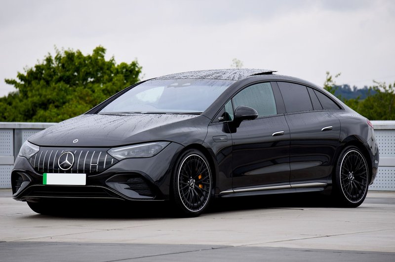 A stylish black Mercedes-Benz EQE electric vehicle parked outdoors. Perfect for automotive enthusiasts.
