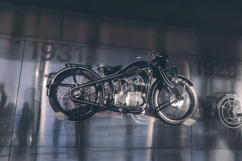 Classic BMW motorcycle showcased in Munich museum, highlighting vintage design and engineering.