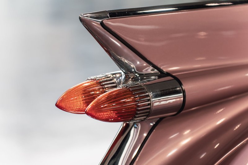Detailed close-up of a vintage car tail fin with iconic design. Perfect for automotive enthusiasts.